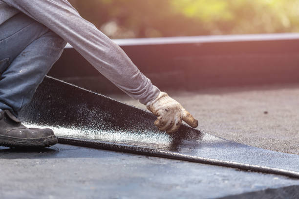 Professional Basement Waterproofing technician working in Faxon, PA